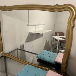Gold Mirror With Hanging Chain In The Back