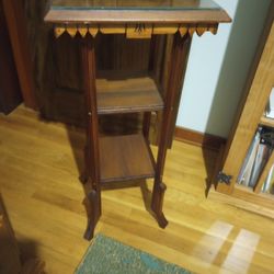 Wooden Stand With Scroll Art On Top