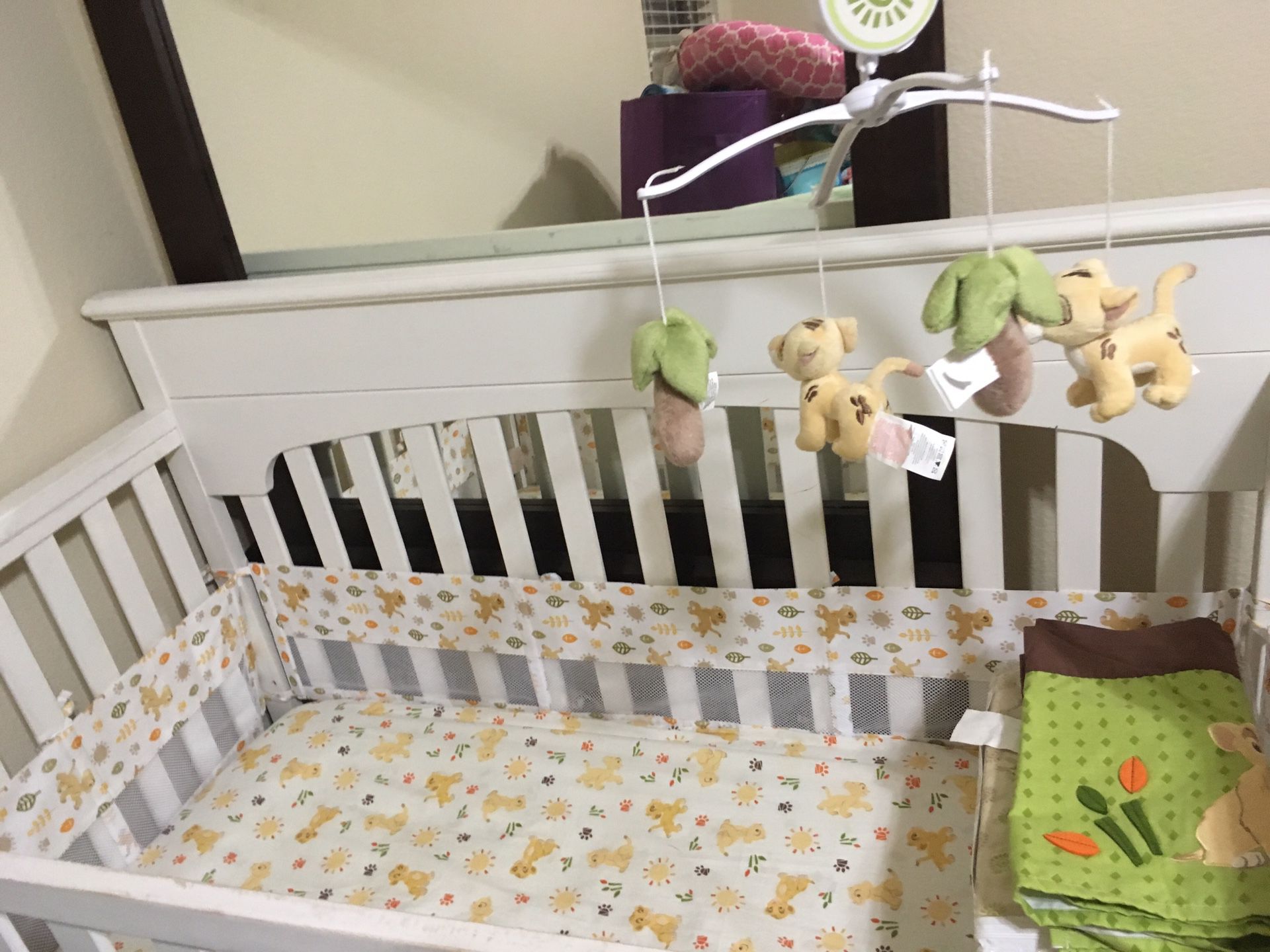 White baby bed with mattress