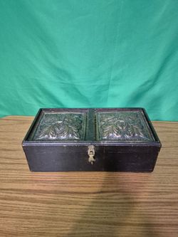 Wooden storage chest with lid and decorative brass tiles hand made vintage 14 inches long.  Broken clasp.