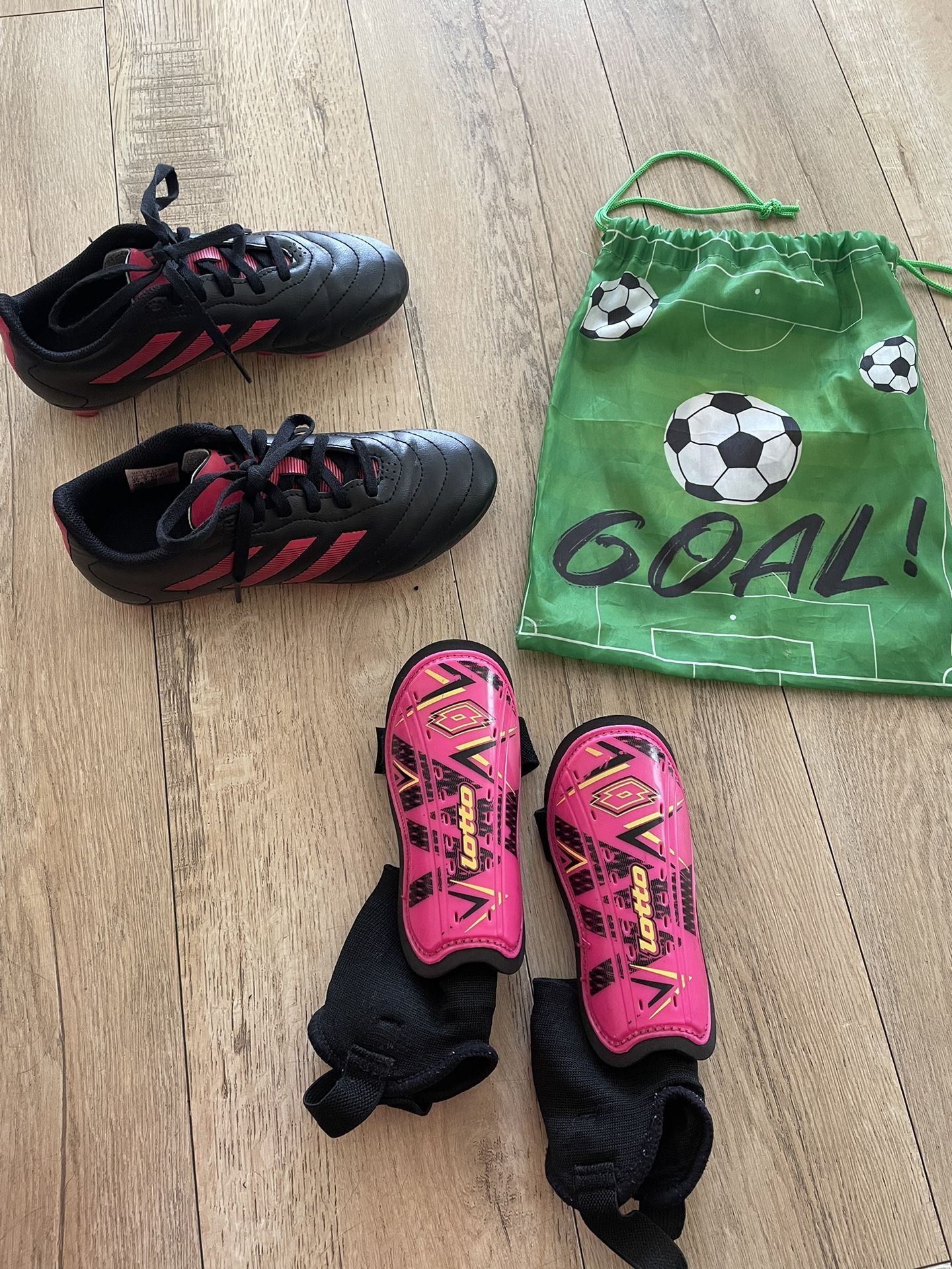 Adidas black/ pink sports cleats sz 2.5 Includes Shinguards And Green Bag