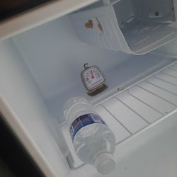 apartment size fridges needs cleaning 