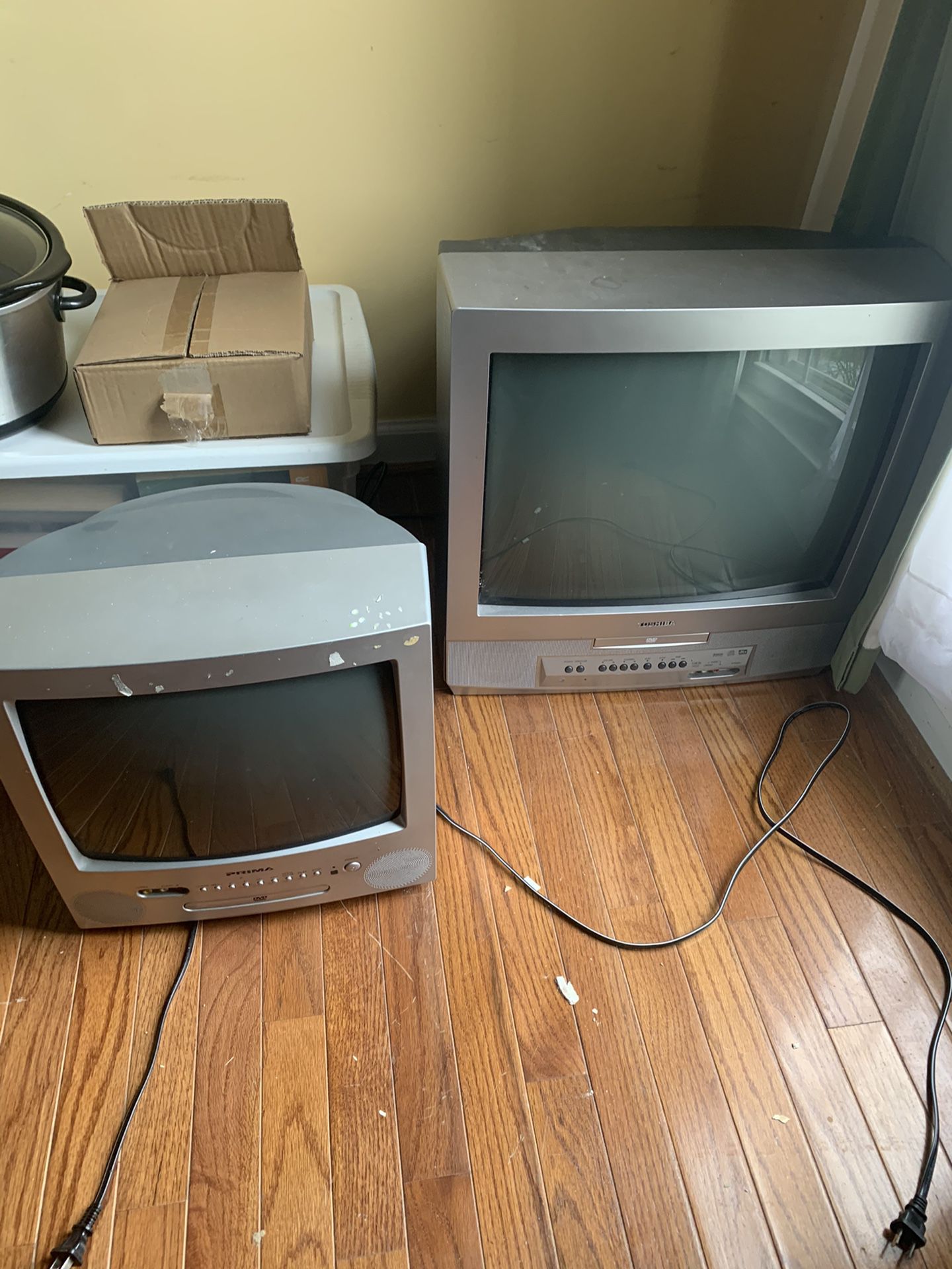 Two old school TVs with DVD players built in