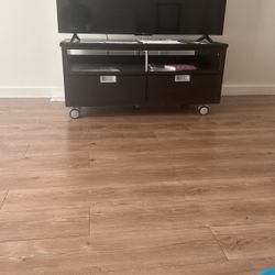 60” TCL TV With Stand Movable,  Brown  Color Made Of Wood, With Two Drawer  