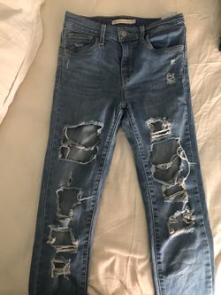 Worn Levis distressed jeans size 25 asking for $15