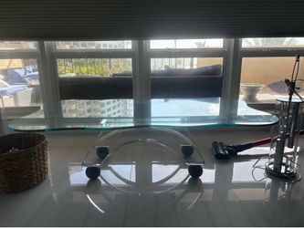 Glass table with a black balls on bottom 5gy long 30