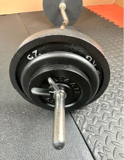 48 inches Steel Standard Barbell W/Weight Plates: 25s, 10s and 5s ponders. 93 # Brute W.