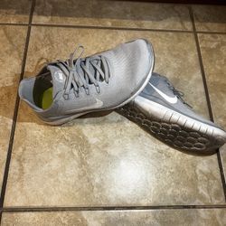 Grey Nike Free runs. 