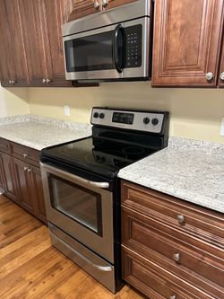 Like new oven clean top with microwave over the stove top.