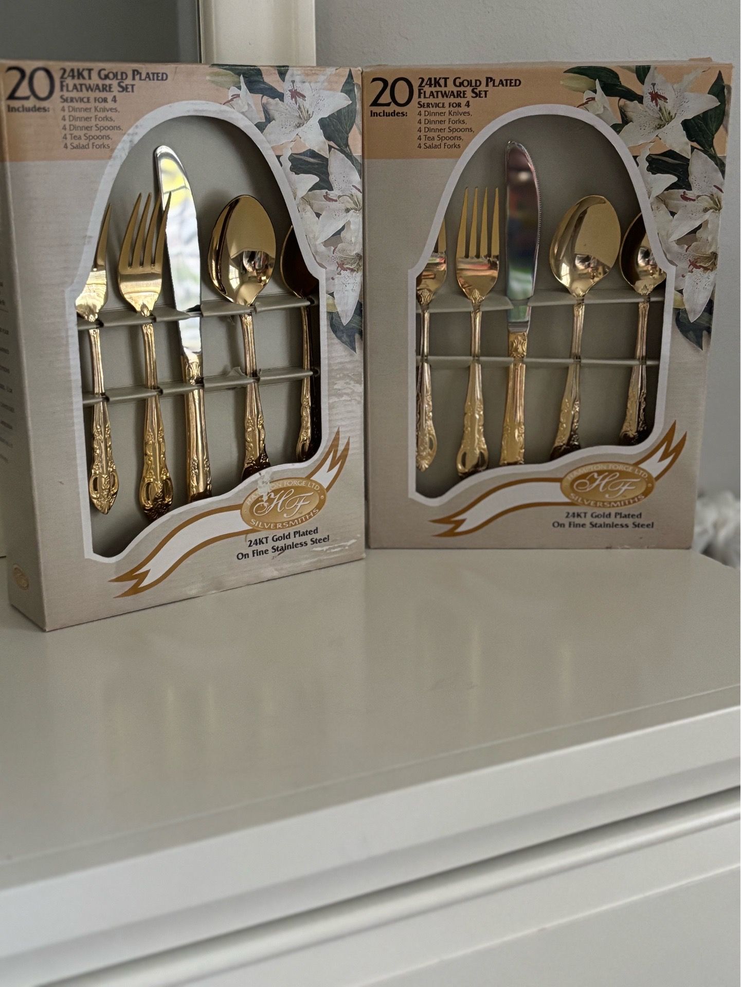 Brand new silverware set of two, each set service for 4 (two tones gold and Silver)