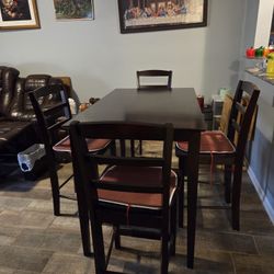 Used Brown Table And 4 Chairs