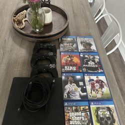 PS4 with Controllers and Games 