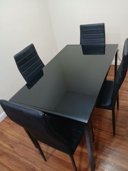Black dining room table with 4 chairs