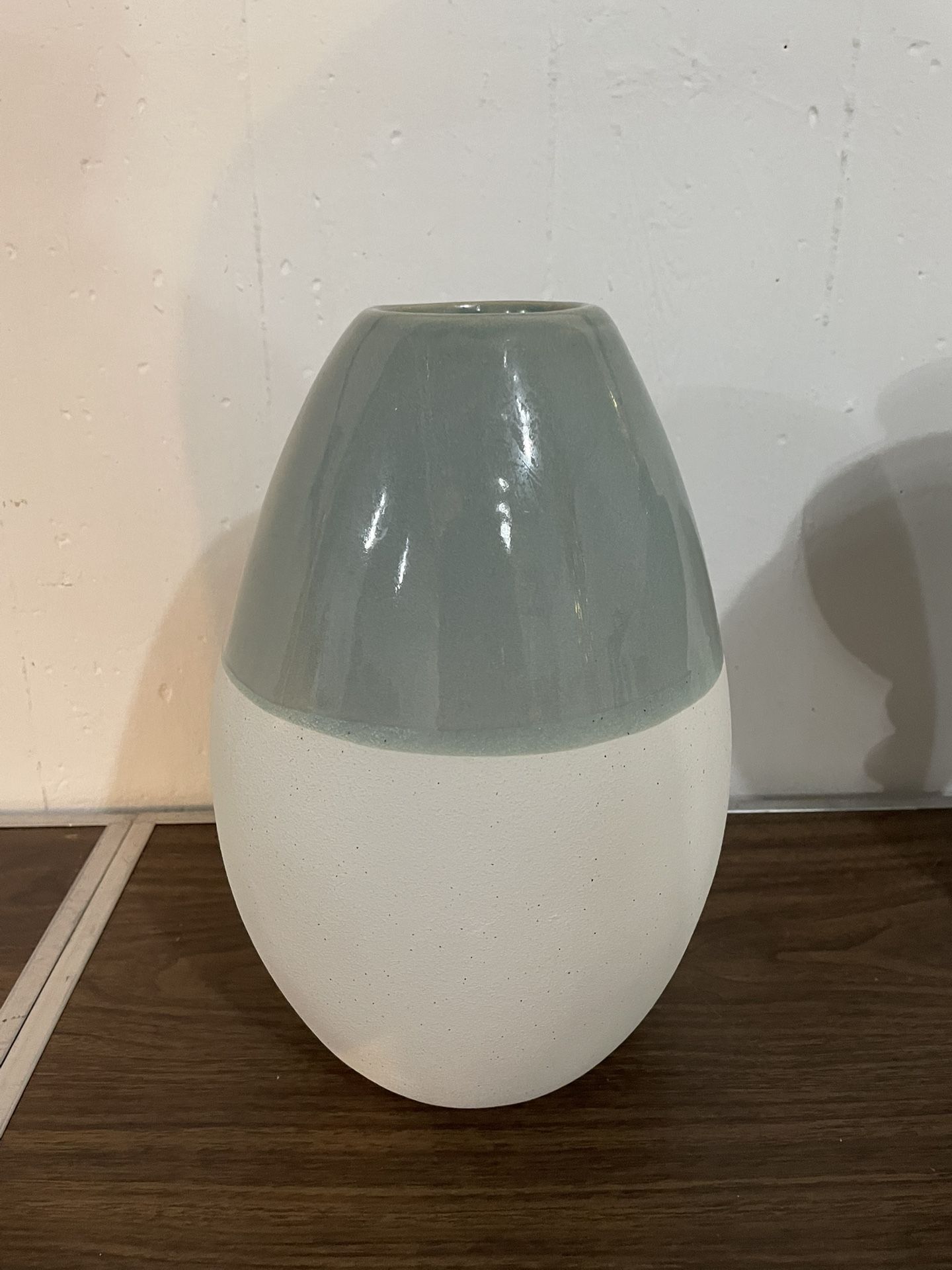Elegant two-tone ceramic vase in blue gray and white.