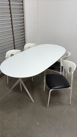 Oval white conference / dining table with 4 matching chairs
