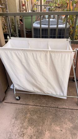 FREE 3-compartment rolling laundry sorter with a top cover