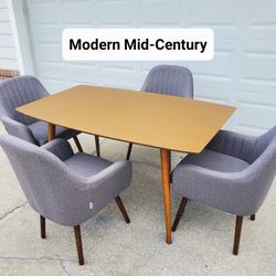 Mid-Modern Dining Table with Four Cushioned Grey Chairs