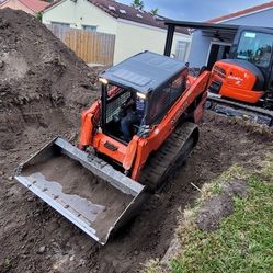 Bobcat Y Escavadora