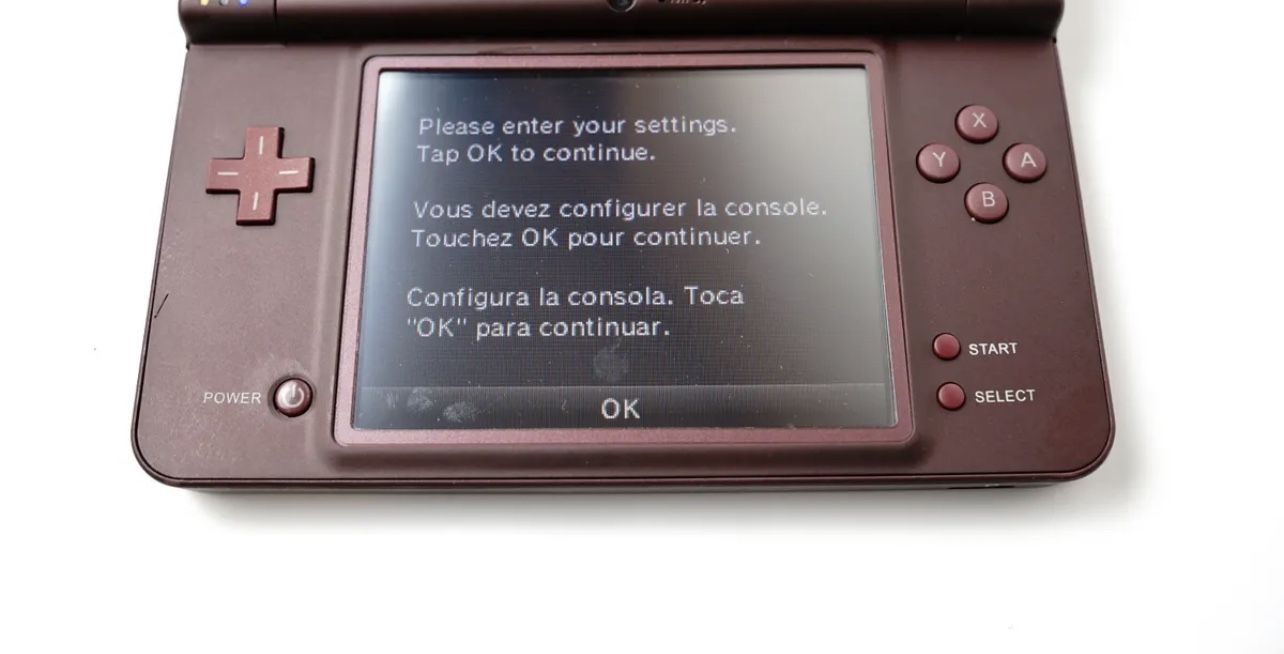 Restored Nintendo DSi XL (Burgundy) Handheld Video Game Console with Stylus  and Charger (Refurbished) 