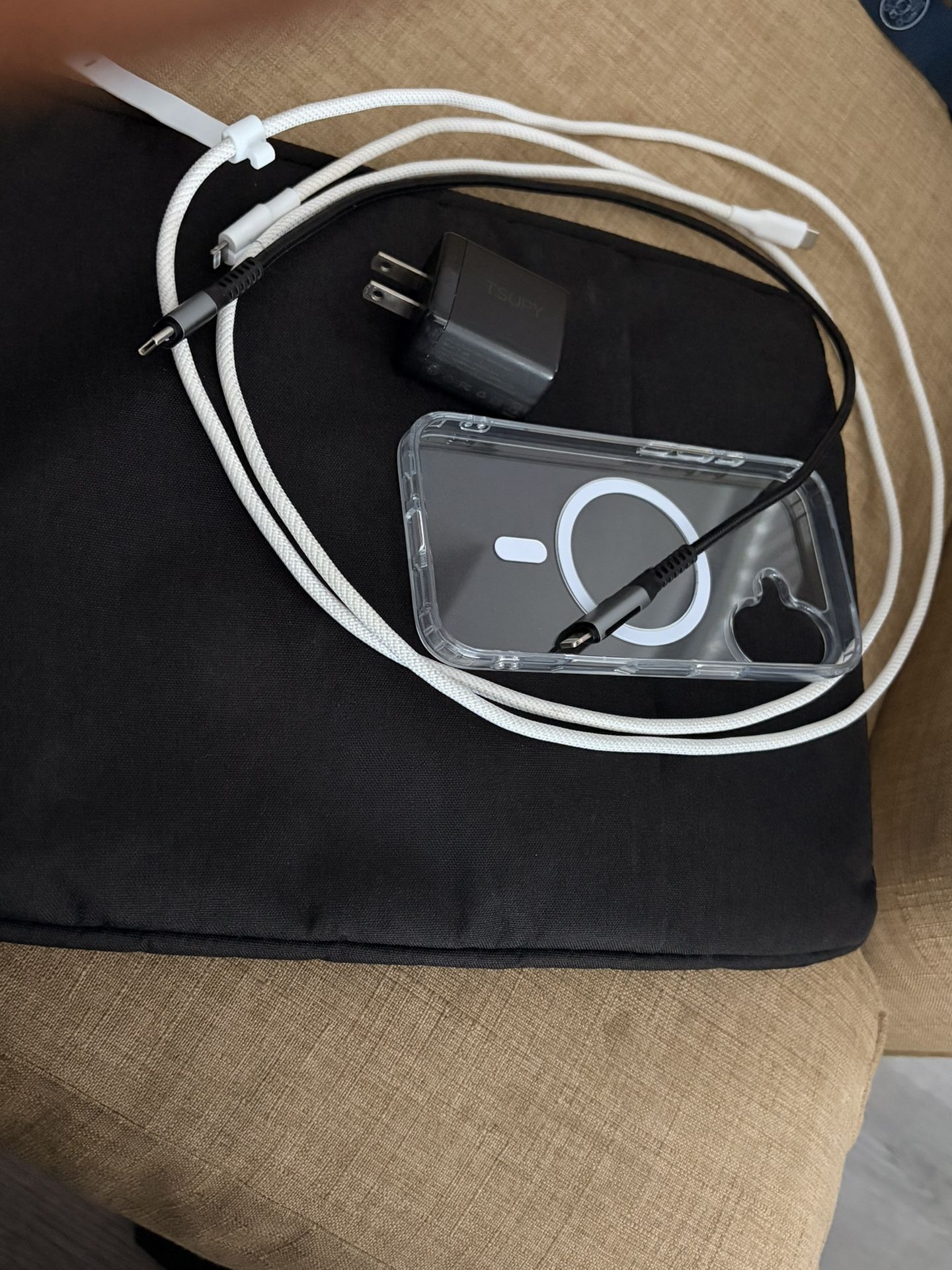 Laptop case, Usb to lighting cables and usb c charging box, Plus an iphone 17 magsafe clear case.