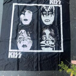 KISS tapestry, banner, or pillow featuring the band's iconic face paint, likely produced by Nikry Co. Inc. in the 1980s. 