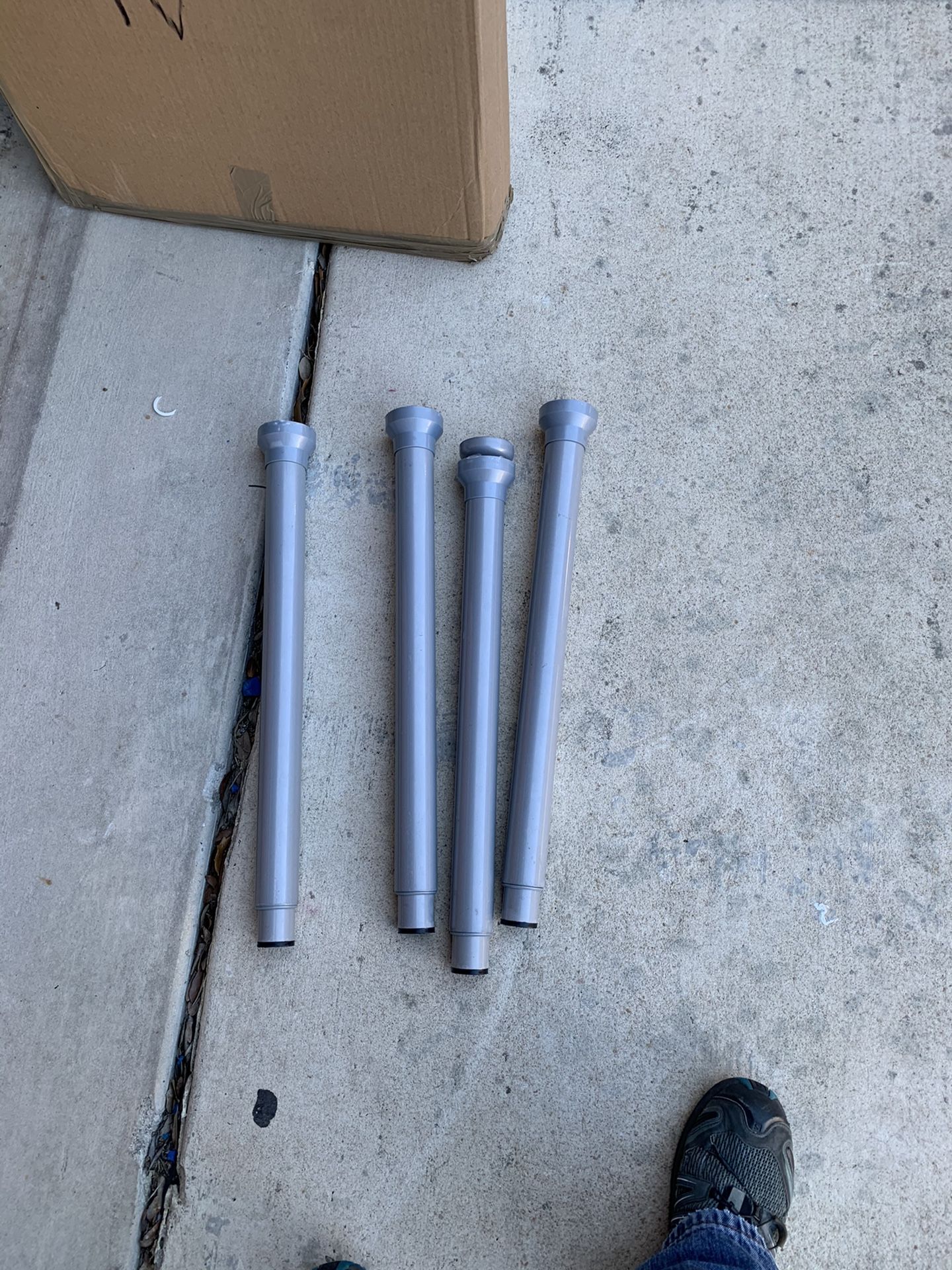 Glass desk/ table with adjustable height legs, capable of handling TVs or Computers.