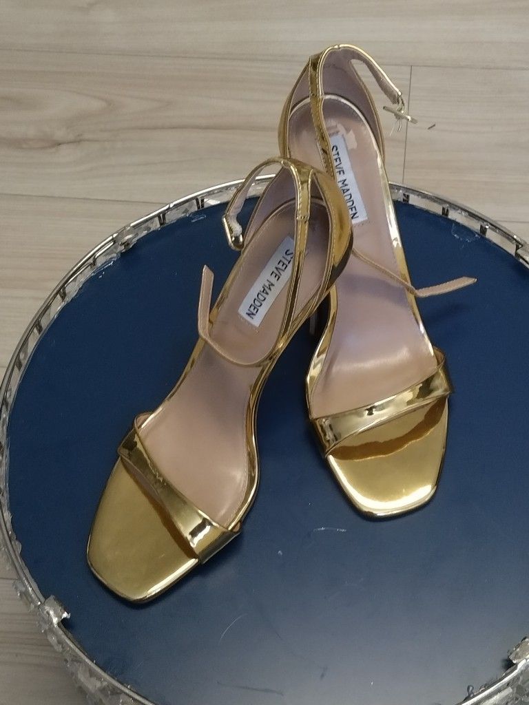 Gold Steve Madden High Heels.