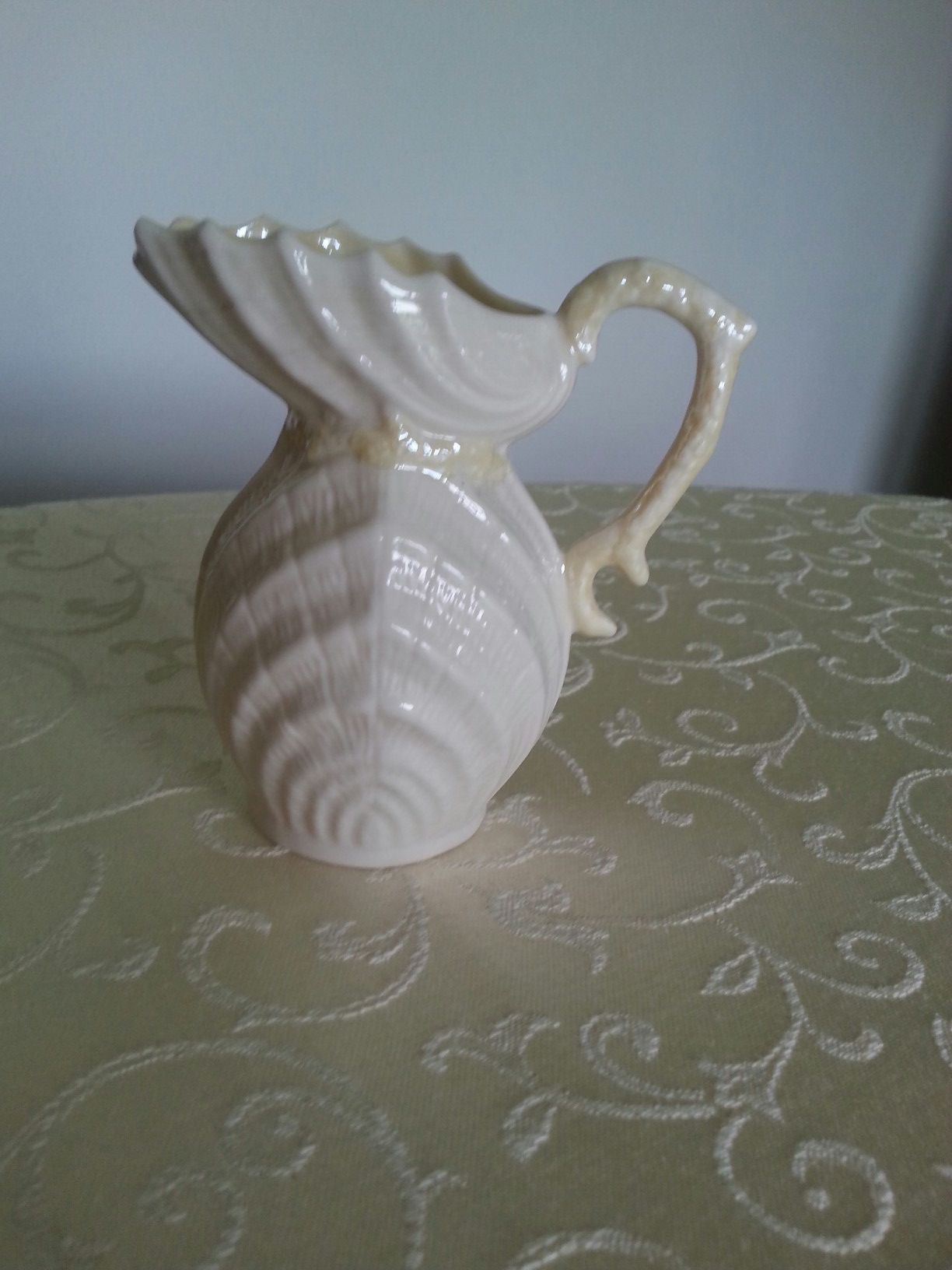 Belleek yellow nepture small pitcher