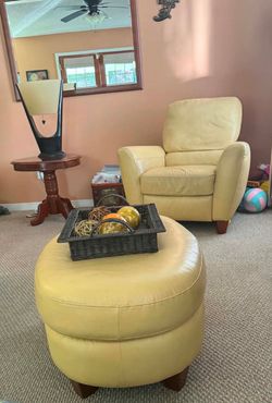 Yellow leather arm chair with matching ottoman
