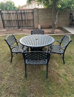 Patio set. Very nice condition. All metal. Table and chairs.