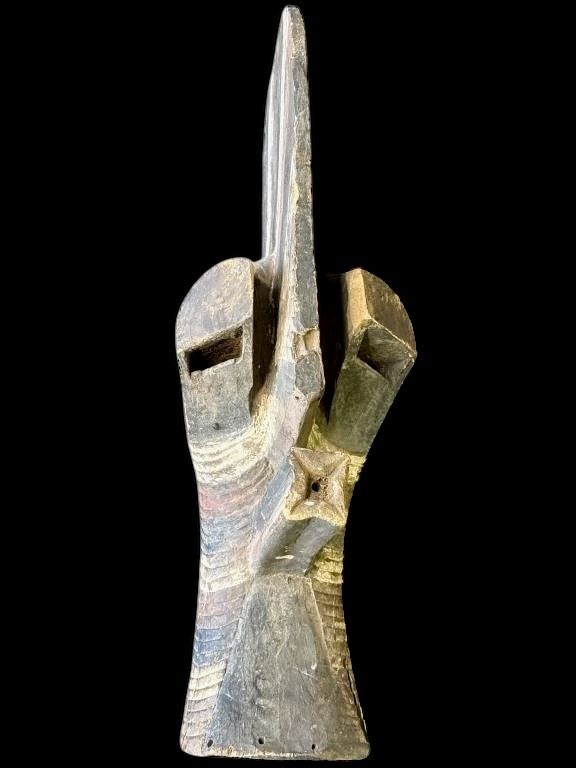 Striking hand-carved African wood mask in the Songye Kifwebe tradition. Bold geometric carving, tall central crest, and deep linear patterning with st