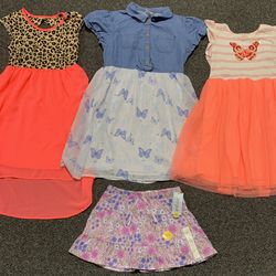 Bundled lot of 3 girls size 10/12 butterfly and leopard tulle dresses and a brand new floral skirt