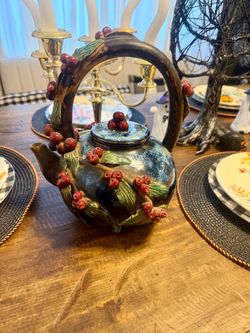 Decorative leaf and cherry teapot