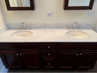 WALNUT VANITY AND MEDICINE CABINETS WITH GRAY MARBLE TOP AND DUAL INTEGRATED SINKS