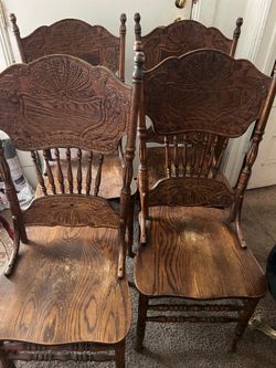 A set of 4 These antique farmhouse-style chairs