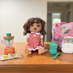 Baby Alive With A Bag Of Doll Clothes