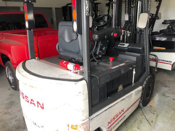 Six Nissan electric forklifts