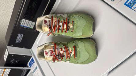 New Balance 574 Green Sneakers with Rainbow Laces