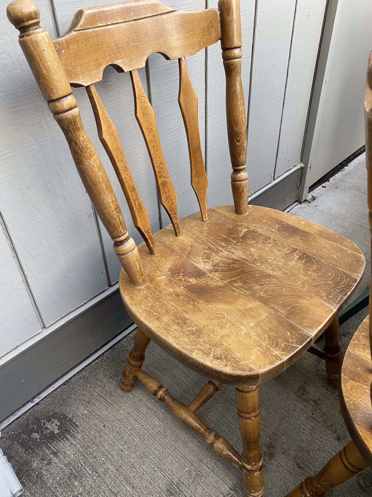 4 matching solid wood chairs.