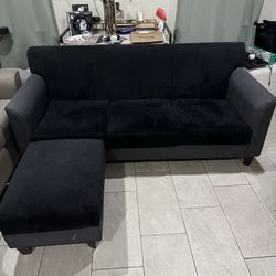 2 black couches with ottoman