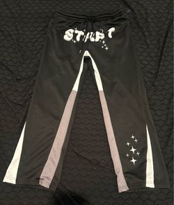 Black/grey sweatpants with white lettering