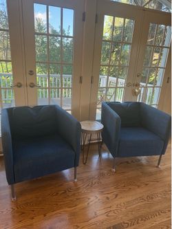 Two blue ikea chairs