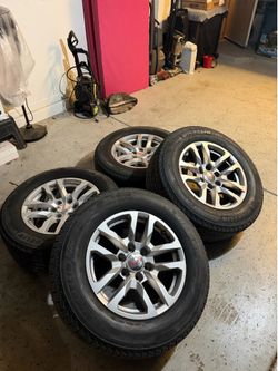 Gmc Sierra/Yukon OEM Silver Stock Wheels 18”