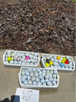 3 containers of golf balls