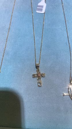 Cross pendant with rose