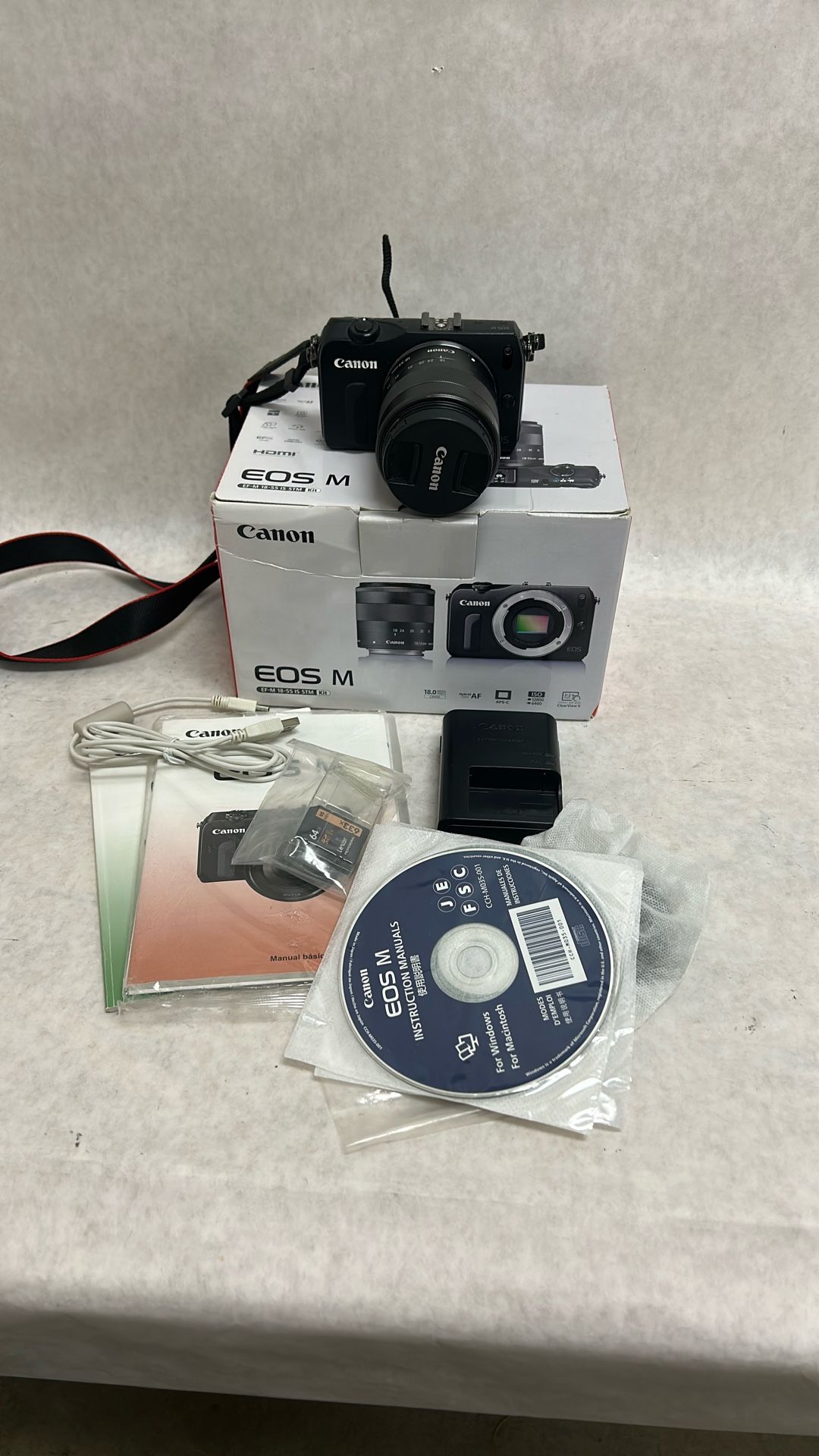 Canon Eos M Kit 18 Megapixel With 18 To 55 IS STM LENS. 64 GB SSD card manual charger cord original box.