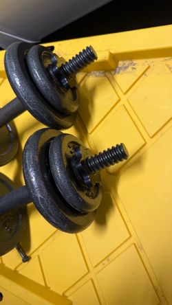 Two dumbbell handles with four spin locks 45 pound plates and four 2 1/2 pound plates $50