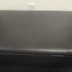 A Better Homes and Garden faux leather dark brown storage ottoman/bench. 