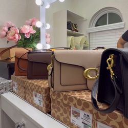 Women's handbag with dust bag and box—excellent quality.