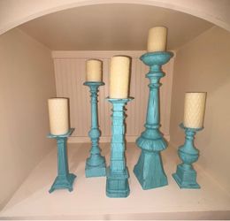 set of distressed turquoise or teal wooden pillar candle holders